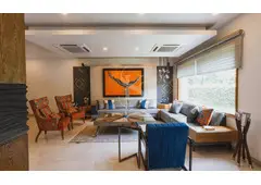 What are the common challenges faced by luxury interior designers when working with high-end clients