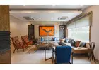 What are the common challenges faced by luxury interior designers when working with high-end clients